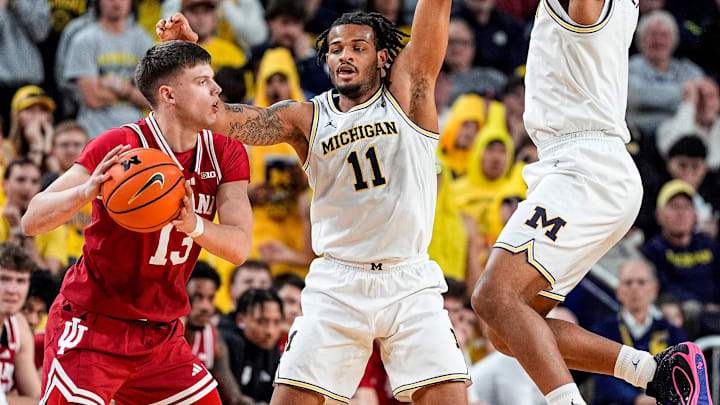 Michigan guard Roddy Gayle Jr. (11) and guard Trey McKenney (1) defend Indiana guard Aleksa Ristic (13) during the second half at Crisler Center in Ann Arbor on Tuesday, Jan. 20, 2026. Michigan guard Roddy Gayle Jr. (11) and guard Trey McKenney (1) defend Indiana guard Aleksa Ristic (13) during the second half at Crisler Center in Ann Arbor on Tuesday, Jan. 20, 2026.