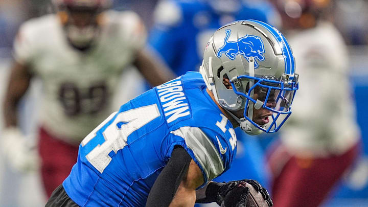 Detroit Lions wide receiver Amon-Ra St. Brown (14) catches a pass late in the fourth quarter during the NFL game against the Washington Commanders at Ford Field in Detroit, Mich, Saturday, Jan. 18, 2025.