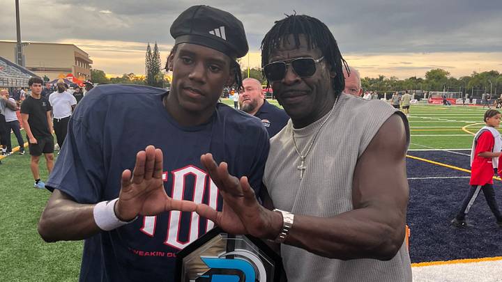 Columbus athlete and Miami commit A'mir Sears with former University of Miami star and Pro Football Hall of Famer Michael Irvin at St. Thomas Aquinas on Aug. 29, 2026.