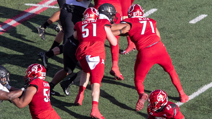 Louisville center Austin Collins blocks on a touchdown run against Wake forest. Dec. 11, 2020
A Collins Louisville center Austin Collins blocks on a touchdown run against Wake forest. Dec. 11, 2020
A Collins