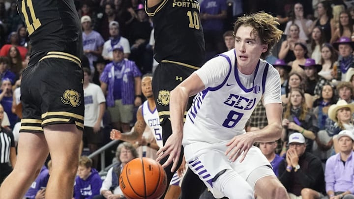 Grand Canyon Antelopes guard Dusty Stromer (8) passes the ball around Purdue Fort Wayne Mastodons forward Maximus Nelson (11) on Nov. 3, 2025, at GCU Arena in Phoenix.