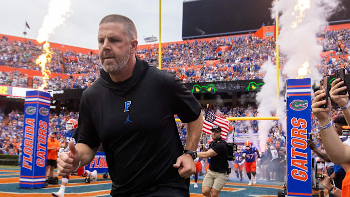 Florida Gators head coach Billy Napier runs onto the field before the start of the game at Ben Hill Griffin Stadium in Gainesville, FL on Saturday, September 7, 2024 against the Samford Bulldogs. The Gators won 45-7. [Doug Engle/Gainesville Sun]