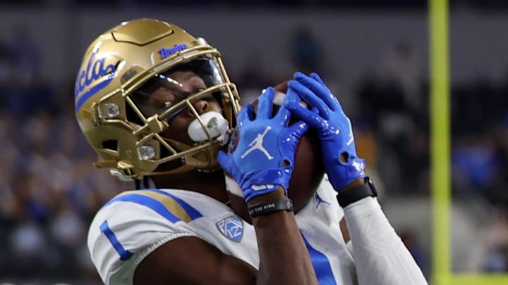 Dec 16, 2023; Inglewood, CA, USA; UCLA Bruins wide receiver J. Michael Sturdivant (1) a touchdown pass against Boise State Broncos cornerback A'Marion McCoy (21) in the fourth quarter of the LA Bowl at SoFi Stadium. Mandatory Credit: Kiyoshi Mio-Imagn Images Dec 16, 2023; Inglewood, CA, USA; UCLA Bruins wide receiver J. Michael Sturdivant (1) a touchdown pass against Boise State Broncos cornerback A'Marion McCoy (21) in the fourth quarter of the LA Bowl at SoFi Stadium. Mandatory Credit: Kiyoshi Mio-Imagn Images