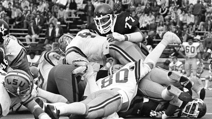 Vanderbilt defensive end Dennis Harrison (77), top, tackles LSU tailback Charles Alexander (4) to make the stop. The Commodores lost 28-15 in Nashville Oct. 8, 1977.

Title Sec Classic Vandy Vs Lsu