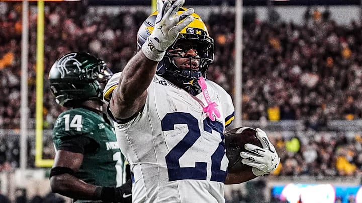 Michigan running back Justice Haynes (22) runs for a touchdown against Michigan State Michigan running back Justice Haynes (22) runs for a touchdown against Michigan State