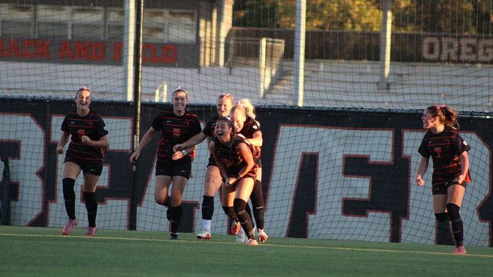The Oregon State Women's Soccer team celebrating after a goal.