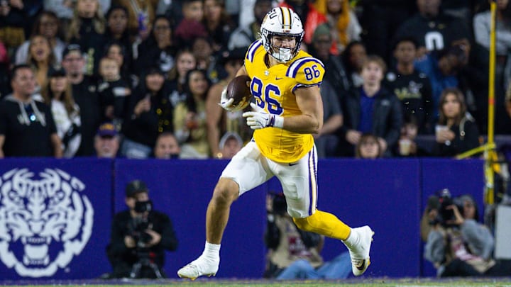 Nov 23, 2024; Baton Rouge, Louisiana, USA;  LLSU Tigers tight end Mason Taylor (86) runs after a catch against the Vanderbilt Commodores during the first half at Tiger Stadium. Mandatory Credit: Stephen Lew-Imagn Images