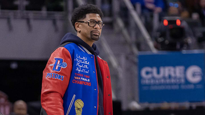 Dec 11, 2022; Detroit, Michigan, USA; Detroit native, former NBA and University of Michigan player, Jalen Rose stands and watches the game action court side between the Detroit Pistons and the Los Angeles Lakers during the in the first half at Little Caesars Arena. Mandatory Credit: David Reginek-Imagn Images