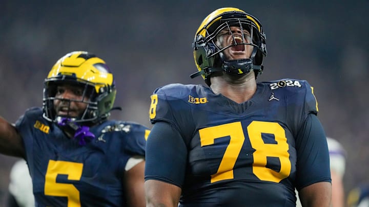Michigan defensive lineman Kenneth Grant celebrates a sack on Washington quarterback Michael Penix Jr. during the College Football Playoff national championship game against Washington at NRG Stadium in Houston, Texas, on Monday, Jan. 8, 2024.