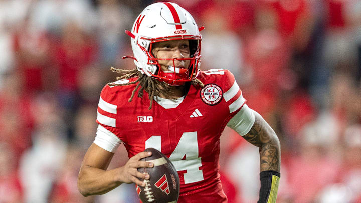 Nebraska quarterback TJ Lateef scrambles for a 9-yard gain against Akron. Nebraska quarterback TJ Lateef scrambles for a 9-yard gain against Akron.