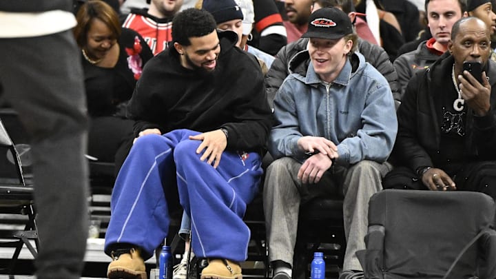 Jan 20, 2026; Chicago, Illinois, USA; Chicago Bears quarterback Caleb Williams, left, and Chicago Cubs outfielder Pete Crow-Armstrong are seen during the first half of the game between the Chicago Bulls and the LA Clippers at United Center. Mandatory Credit: Matt Marton-Imagn Images