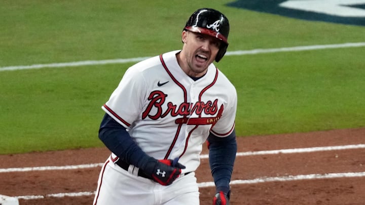 Former Reds and current Braves center fielder Adam Duvall (14) hits a grand slam.