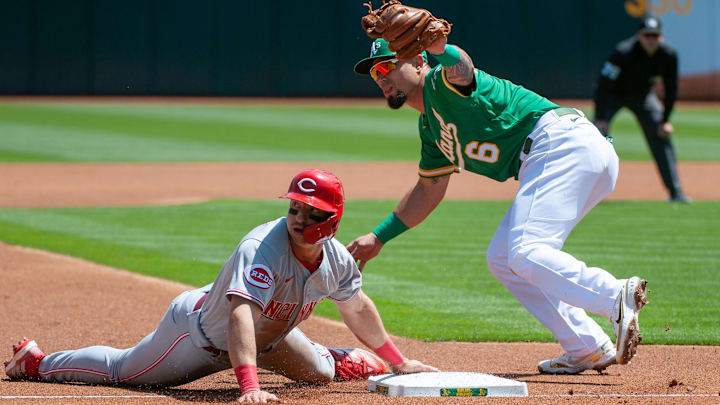 Oakland Athletics third baseman Jace Peterson (6) tags out Cincinnati Reds infielder Spencer Steer