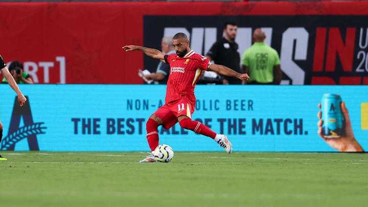 Jul 31, 2024; Philadelphia, PA, USA; Liverpool forward Mohamed Salah (11) kicks the ball against Arsenal at Lincoln Financial Field. Mandatory Credit: Bill Streicher-Imagn Images
