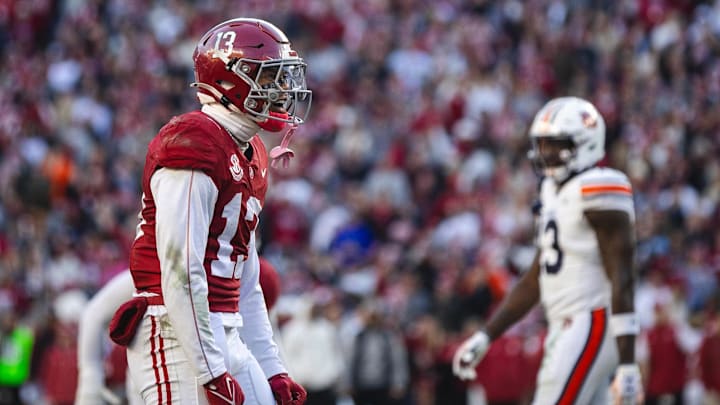 Nov 30, 2024; Tuscaloosa, Alabama, USA; Alabama Crimson Tide defensive back Malachi Moore (13) celebrates after a play against the Auburn Tigers during the second quarter at Bryant-Denny Stadium. Mandatory Credit: Will McLelland-Imagn Images