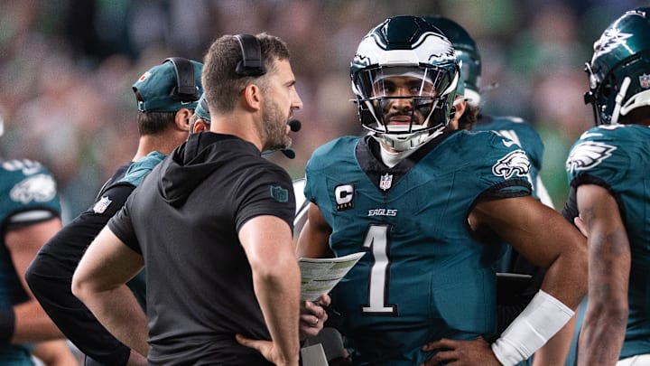 Sep 16, 2024; Philadelphia, Pennsylvania, USA; Philadelphia Eagles quarterback Jalen Hurts (1) talks with head coach Nick Sirianni during a timeout in the first quarter against the Atlanta Falcons at Lincoln Financial Field. Mandatory Credit: Bill Streicher-Imagn Images