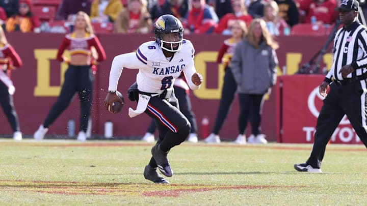 Nov 22, 2025; Ames, Iowa, USA; Kansas Jayhawks quarterback Jalon Daniels (6) runs the football against the Iowa State Cyclones during the second half at Jack Trice Stadium. Mandatory Credit: Reese Strickland-Imagn Images