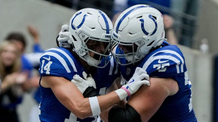 Indianapolis Colts wide receiver Alec Pierce (14) celebrates with Indianapolis Colts guard Will Fries (75) after scoring a touchdown Sunday, Sept. 8, 2024, during a game against the Houston Texans at Lucas Oil Stadium in Indianapolis.