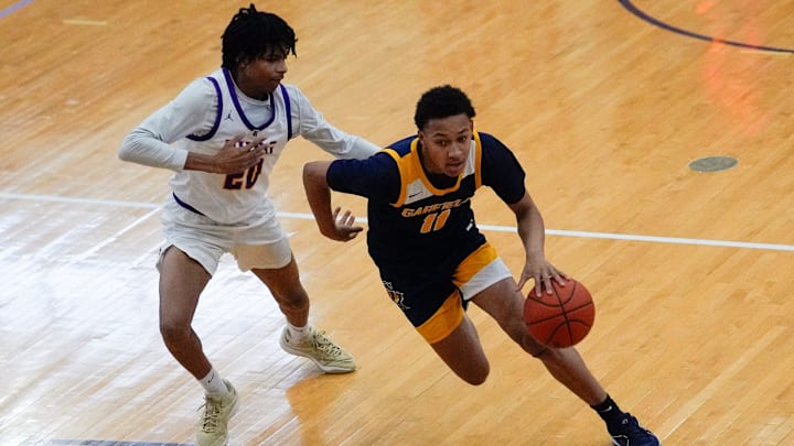 Jan 20, 2024; Reynoldsburg, Ohio, USA; Reynoldsburg Tejuan Barbour (20) guards Garfield Heights Marcus Johnson (11) during the Jared Sullinger Play-By-Play Classic 2024 at Reynoldsburg High School Summit Campus.