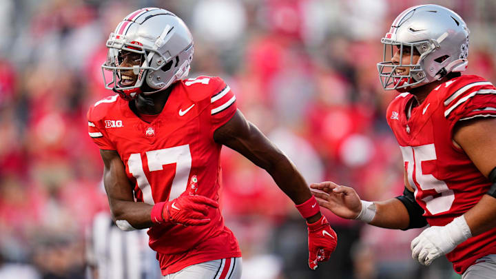 Sep 16, 2023; Columbus, Ohio, USA; Ohio State Buckeyes wide receiver Carnell Tate (17) celebrates a touchdown with offensive lineman Carson Hinzman (75) during the second half of the NCAA football game against the Western Kentucky Hilltoppers at Ohio Stadium. Ohio State won 63-10.