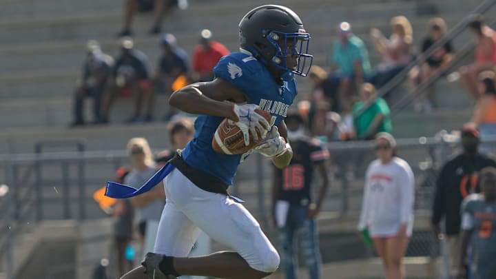 Vernell Brown III (1) runs with the ball during a 2021 preseason jamboree at Leesburg High School in Leesburg. Brown recently received an offer to play for the Univeristy of Michigan. [PAUL RYAN / CORRESPONDENT]