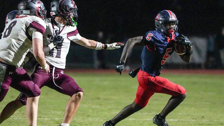 Belton-Honea Path High junior Tajeh Watson-Martin (5) runs for a touchdown near Westside High senior Jacob Lewis (11) during the second quarter at Belton-Honea Path High in Honea Path, S.C. Friday September 12, 2025. Belton-Honea Path High won 42-6, improving to 4-0. Belton-Honea Path High junior Tajeh Watson-Martin (5) runs for a touchdown near Westside High senior Jacob Lewis (11) during the second quarter at Belton-Honea Path High in Honea Path, S.C. Friday September 12, 2025. Belton-Honea Path High won 42-6, improving to 4-0.