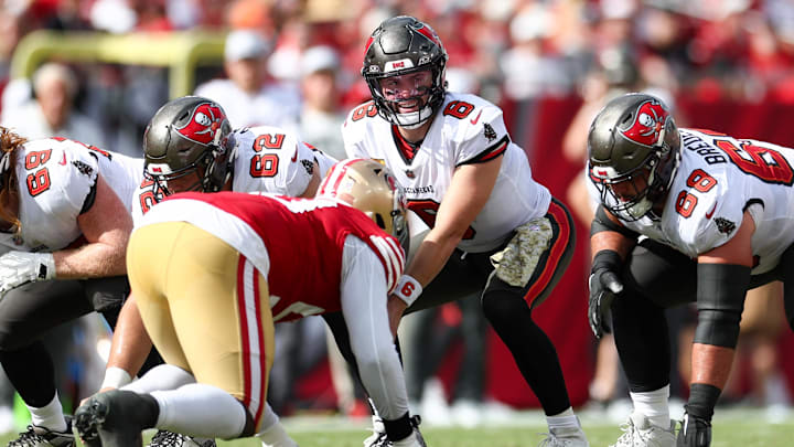 Nov 10, 2024; Tampa, Florida, USA; Tampa Bay Buccaneers quarterback Baker Mayfield (6) lines up under center Graham Barton (62) against the San Francisco 49ers in the second quarter at Raymond James Stadium. Mandatory Credit: Nathan Ray Seebeck-Imagn Images