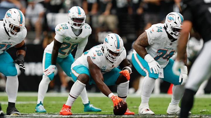 Miami Dolphins center Aaron Brewer (55) prepares to snap the ball against the Las Vegas Raiders at Allegiant Stadium in the 2026 season opener. Miami Dolphins center Aaron Brewer (55) prepares to snap the ball against the Las Vegas Raiders at Allegiant Stadium in the 2026 season opener.
