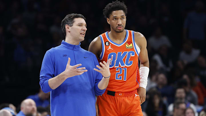 Feb 15, 2023; Oklahoma City, Oklahoma, USA; Oklahoma City Thunder head coach Mark Daigneault talks with Oklahoma City Thunder guard Aaron Wiggins (21) during a break against the Houston Rockets in the second quarter at Paycom Center. Mandatory Credit: Alonzo Adams-Imagn Images