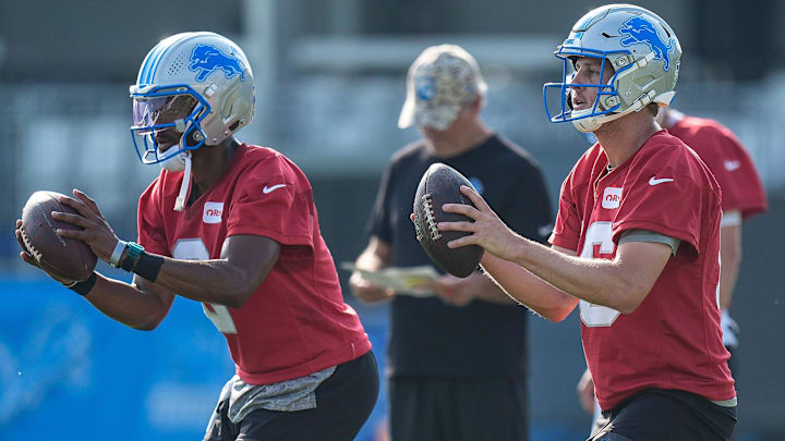 Detroit Lions quarterback Jared Goff (16), right, and quarterback Hendon Hooker (2) practice during training camp at Meijer Performance Center in Allen Park on Thursday, July 24, 2025.
