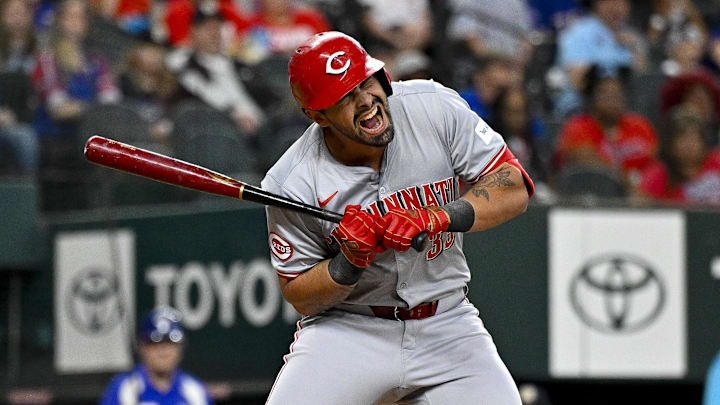 Apr 27, 2024; Arlington, Texas, USA; Cincinnati Reds first baseman Christian Encarnacion-Strand (33) reacts to being hit by a pitch during the second inning against the Texas Rangers at Globe Life Field. Mandatory Credit: Jerome Miron-Imagn Images