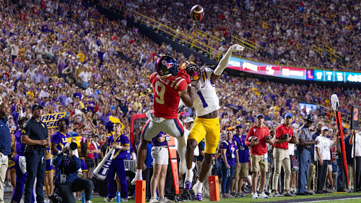 Oct 12, 2024; Baton Rouge, Louisiana, USA; LSU Tigers cornerback Ashton Stamps (1) blocks a pass intended for Mississippi Rebels wide receiver Tre Harris (9) during the second half at Tiger Stadium. Mandatory Credit: Stephen Lew-Imagn Images Oct 12, 2024; Baton Rouge, Louisiana, USA; LSU Tigers cornerback Ashton Stamps (1) blocks a pass intended for Mississippi Rebels wide receiver Tre Harris (9) during the second half at Tiger Stadium. Mandatory Credit: Stephen Lew-Imagn Images