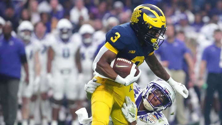 December 31, 2022; Glendale, Ariz; USA; TCU linebacker Dee Winters (13) tackles Michigan wide receiver AJ Henning (3) during the second half at State Farm Stadium. December 31, 2022; Glendale, Ariz; USA; TCU linebacker Dee Winters (13) tackles Michigan wide receiver AJ Henning (3) during the second half at State Farm Stadium.