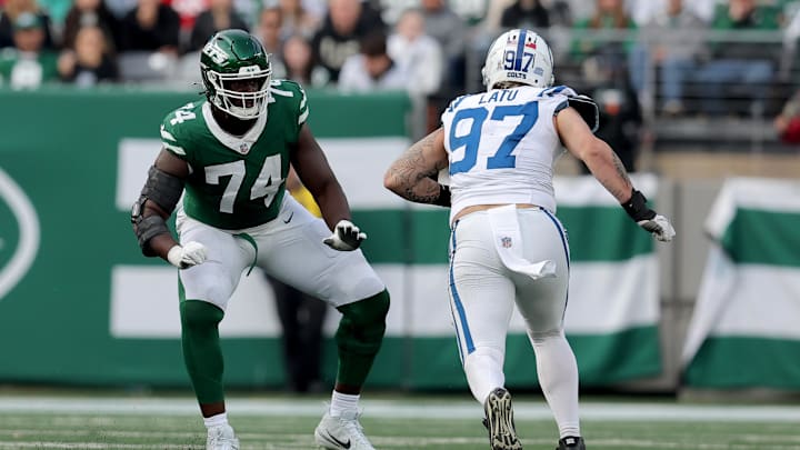 Nov 17, 2024; East Rutherford, New Jersey, USA; New York Jets offensive tackle Olu Fashanu (74) blocks against Indianapolis Colts defensive end Laiatu Latu (97) during the third quarter at MetLife Stadium. 