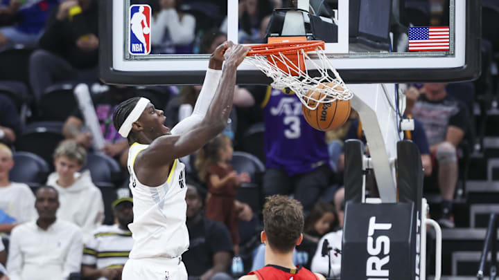 Oct 7, 2024; Salt Lake City, Utah, USA; Utah Jazz forward Taylor Hendricks (0) dunks the ball against the Houston Rockets during the third quarter at Delta Center. Mandatory Credit: Rob Gray-Imagn Images
