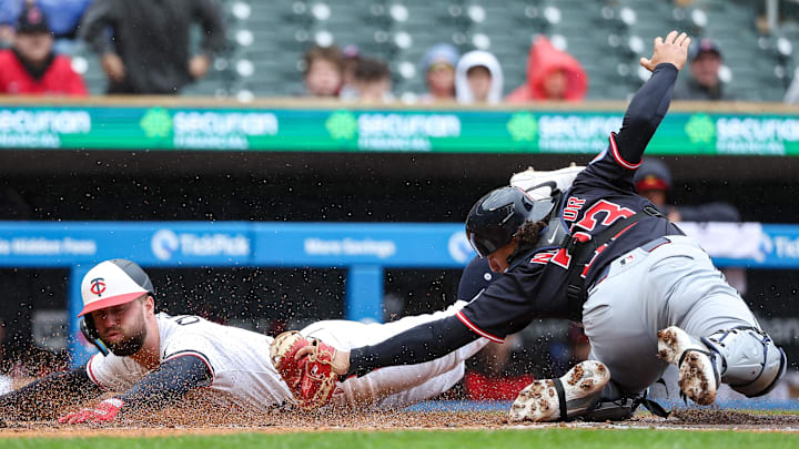 May 21, 2025; Minneapolis, Minnesota, USA; Minnesota Twins second baseman Kody Clemens (18) scores against Cleveland Guardians catcher Bo Naylor (23) in the fourth inning on a sacrifice fly hit by center fielder Harrison Bader (12) during game one of a doubleheader at Target Field. Mandatory Credit: Matt Krohn-Imagn Images May 21, 2025; Minneapolis, Minnesota, USA; Minnesota Twins second baseman Kody Clemens (18) scores against Cleveland Guardians catcher Bo Naylor (23) in the fourth inning on a sacrifice fly hit by center fielder Harrison Bader (12) during game one of a doubleheader at Target Field. Mandatory Credit: Matt Krohn-Imagn Images