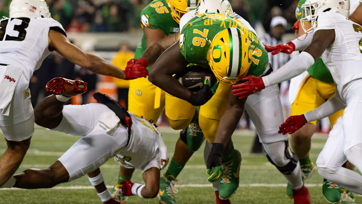 Oregon offensive lineman Josh Conerly Jr. dives in for a two-point conversion as the Oregon Ducks host the Maryland Terrapins at Autzen Stadium Saturday, Nov. 9, 2024 in Eugene, Ore.
