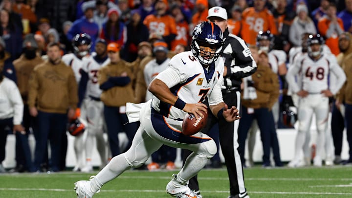 Denver Broncos quarterback Russell Wilson (3) rolls out away from pressure against the Bills.