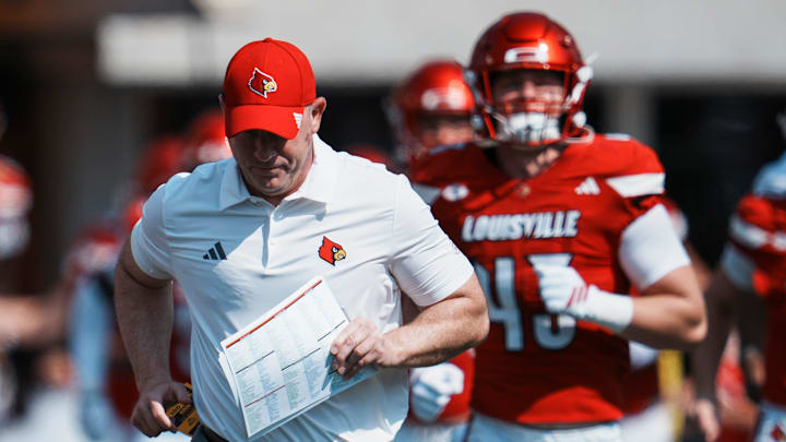 Louisville Cardinals head football coach Jeff Brohm runs onto the field with his team as they take on visiting Bowling Green in Louisville, Kentucky. Sept. 20, 2025 Louisville Cardinals head football coach Jeff Brohm runs onto the field with his team as they take on visiting Bowling Green in Louisville, Kentucky. Sept. 20, 2025