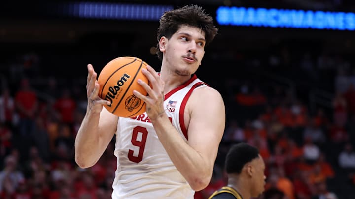 Mar 26, 2026; Houston, TX, USA; Nebraska Cornhuskers forward Berke Buyuktuncel (9) grabs a rebound against the Iowa Hawkeyes in the first half during a Sweet Sixteen game of the South Regional of the men's 2026 NCAA Tournament at Toyota Center. Mandatory Credit: Troy Taormina-Imagn Images Mar 26, 2026; Houston, TX, USA; Nebraska Cornhuskers forward Berke Buyuktuncel (9) grabs a rebound against the Iowa Hawkeyes in the first half during a Sweet Sixteen game of the South Regional of the men's 2026 NCAA Tournament at Toyota Center. Mandatory Credit: Troy Taormina-Imagn Images