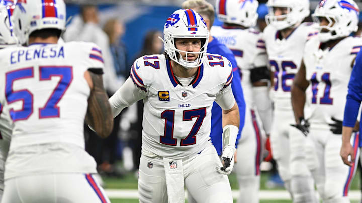 Buffalo Bills quarterback Josh Allen (17) hands the ball off during pregame warmups before their game against the Detroit Lions at Ford Field. Mandatory Credit: Lon Horwedel-Imagn Images