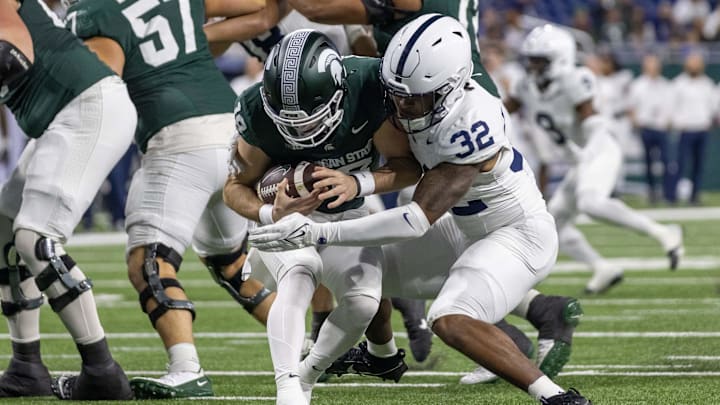 Nov 24, 2023; Detroit, Michigan, USA; Penn State Nittany Lions linebacker Keon Wylie (32) sacks Michigan State Spartans quarterback Katin Houser (12) during the second half at Ford Field. Mandatory Credit: David Reginek-Imagn Images Nov 24, 2023; Detroit, Michigan, USA; Penn State Nittany Lions linebacker Keon Wylie (32) sacks Michigan State Spartans quarterback Katin Houser (12) during the second half at Ford Field. Mandatory Credit: David Reginek-Imagn Images