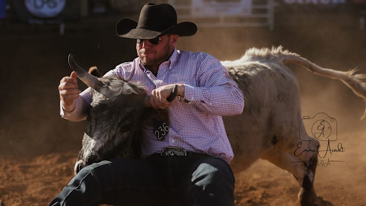 A steer wrestler competes at the Gripp N Flipp Steer Wrestling Jackpot