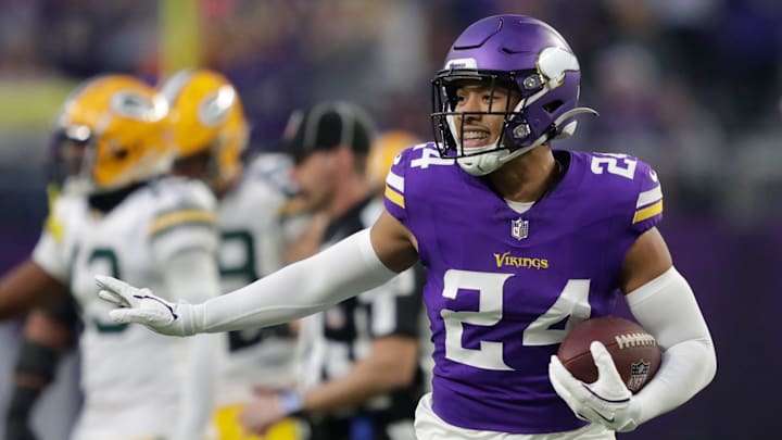 Minnesota Vikings safety Camryn Bynum (24) celebrates recovering a fumble by Green Bay Packers running back Josh Jacobs (8) in the first quarter during their football game Sunday, December 29, 2024, at U.S. Bank Stadium in Minneapolis, Minnesota.