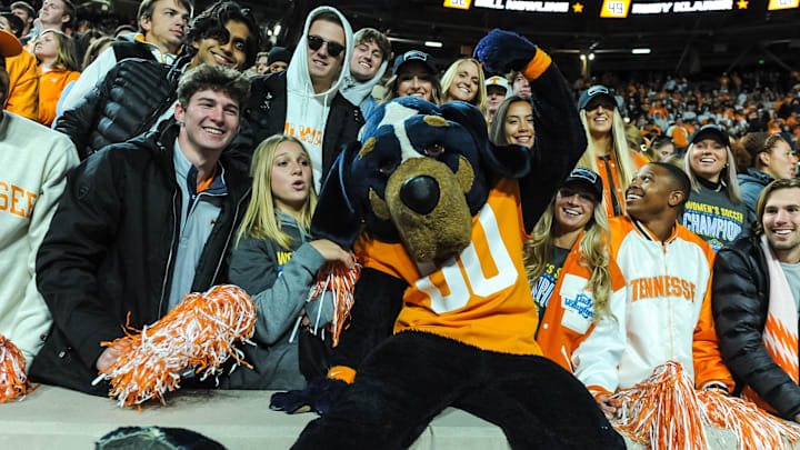 Nov 13, 2021; Knoxville, Tennessee, USA; Tennessee Volunteers fans and Smokey celebrate during the