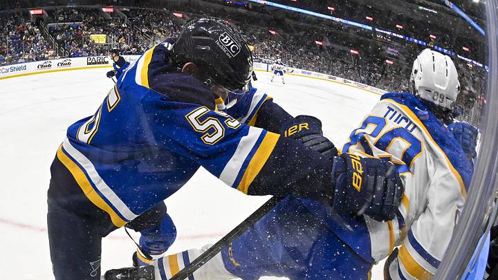 Dec 29, 2024; St. Louis, Missouri, USA;  St. Louis Blues defenseman Colton Parayko (55) checks Buffalo Sabres right wing Alex Tuch (89) during the first period at Enterprise Center. Mandatory Credit: Jeff Curry-Imagn Images