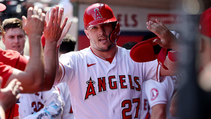 Oct 2, 2022; Anaheim, California, USA; Los Angeles Angels center fielder Mike Trout (27) is greeted