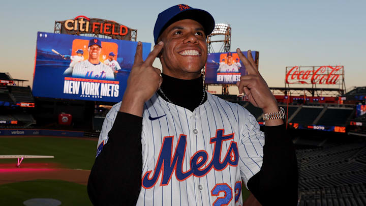 Dec 12, 2024; Flushing, NY, USA; New York Mets right fielder Juan Soto poses for photos during his introductory press conference at Citi Field. Mandatory Credit: Brad Penner-Imagn Images