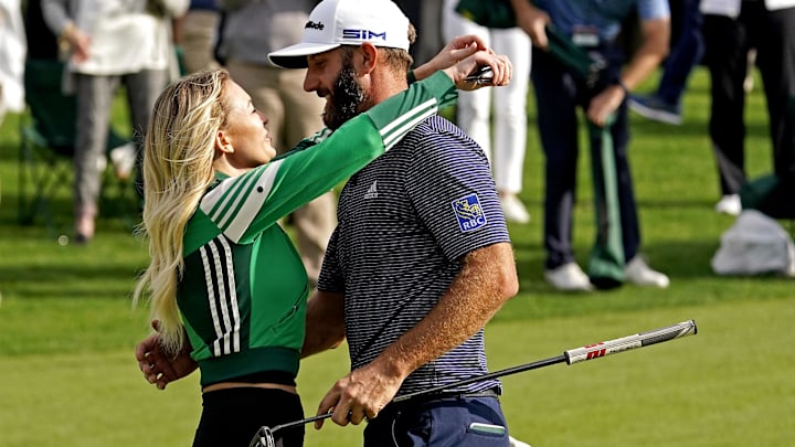 Dustin Johnson hugs his wife Paulina Gretzky after winning The Masters golf tournament at Augusta National GC.