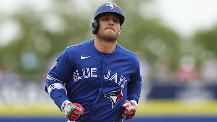 Toronto Blue Jays center fielder Daulton Varsho (5) runs the bases after hitting a two-run home run.